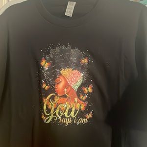 A large, black, women’s, with a colorful image. Urban, %100 cotton